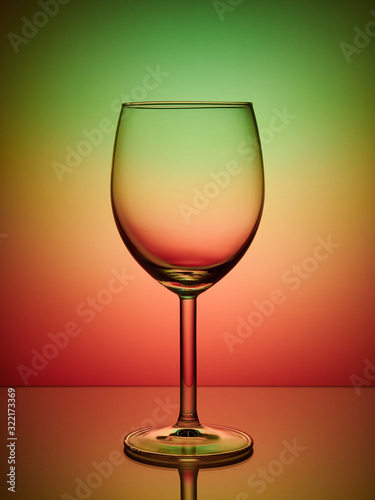 Glass close-up neon colored red green light gradient background