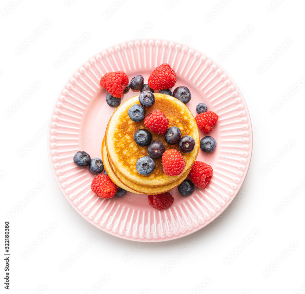 Sweet homemade pancakes with blueberries and raspberries. Sweet homemade pancakes with blueberries and raspberries.