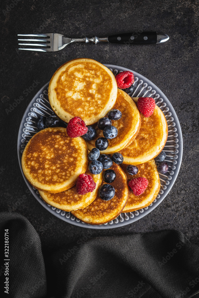 Sweet homemade pancakes with blueberries and raspberries