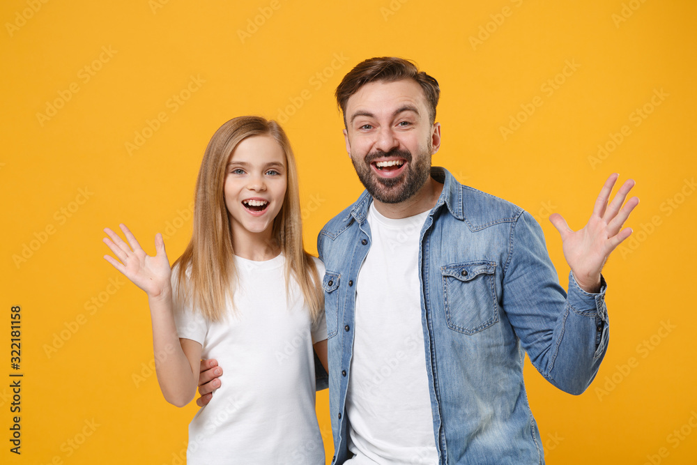 Excited bearded man in casual clothes have fun with child baby girl. Father, little kid daughter isolated on yellow orange background. Love family day, parenthood childhood concept. Spreading hands. Excited bearded man in casual clothes have fun with child baby girl. Father, little kid daughter isolated on yellow orange background. Love family day, parenthood childhood concept. Spreading hands.