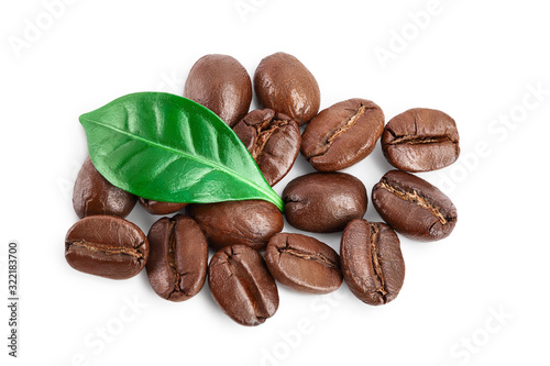 Heap of roasted coffee beans with leaves isolated on white background with clipping path and full depth of field . Top view. Flat lay.