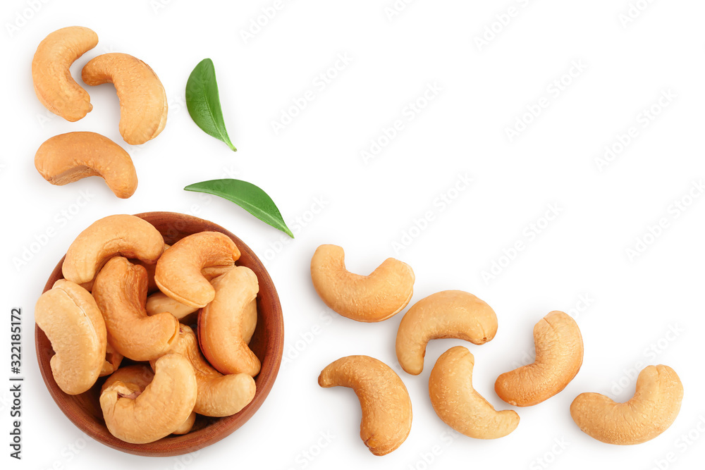Roasted Cashew nuts in bowl isolated on white background with clipping path and full depth of field. Top view with copy space for your text. Flat lay