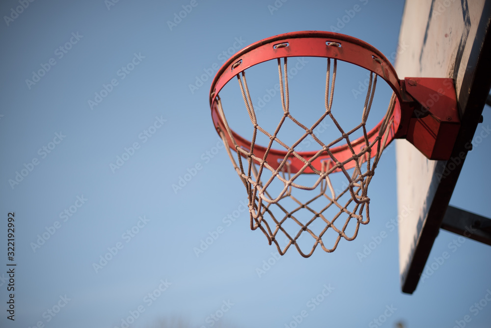 Metal chain basketball net heavy construction. Basketball ball on basketball pitch