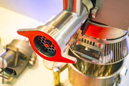 Meat grinder in the food in...