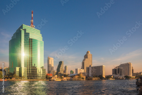 Bangkok Skyline as Seen from the Eastern Chao Phraya River Embankment at Sunset photo