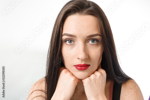 Business young beautiful lady on a white background shows different emotions copy space