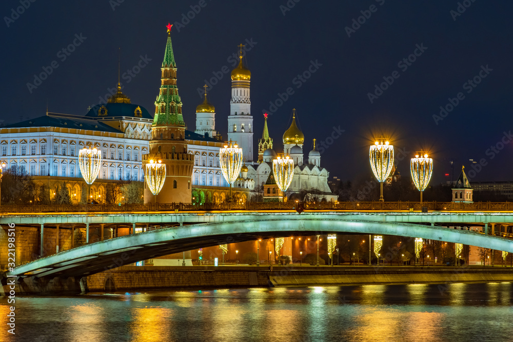 Moscow. Russia. Grand Kremlin Palace. View of the Kremlin embankment from the Moscow River. Night. Lights of Christmas Moscow. Kremlin towers on the background of the night sky. New year in Russia