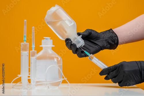 A man takes fluid from a dr...