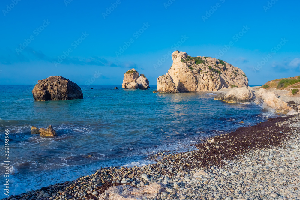 Cyprus. Rock Aphrodite on the background of blue sky. The beaches of the Republic of Cyprus. The rock of love. Aphrodite stone on the shore of the Mediterranean Sea. Nature near the city of Paphos.