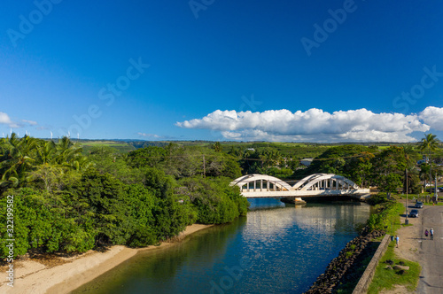 Aerial shot of the river anahulu and the twin arched road bridge in the North Shore town of Haleiwa photo