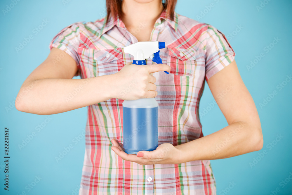 Cleaning: Woman Holding Sprayer of Liquid in Front Cleaning: Woman Holding Sprayer of Liquid in Front