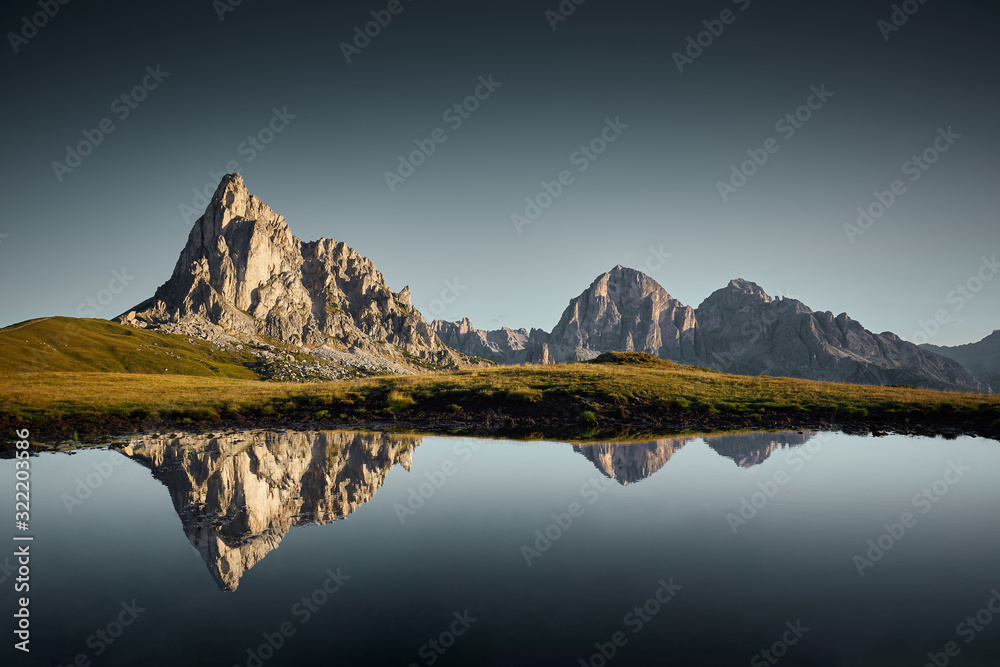 Incredible mirror image in the water of the peak Ra Gusela in the morning light, Averau - Nuvolau group from Passo di Giau. Dolomiti Alps, Cortina d'Ampezzo location, South Tyrol, Italy, Europe.