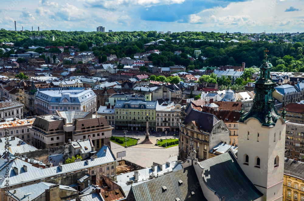 Old city vintage top view panorama with houses roofs and Latin Cathedral seen from the town hall in Lviv, Ukraine
