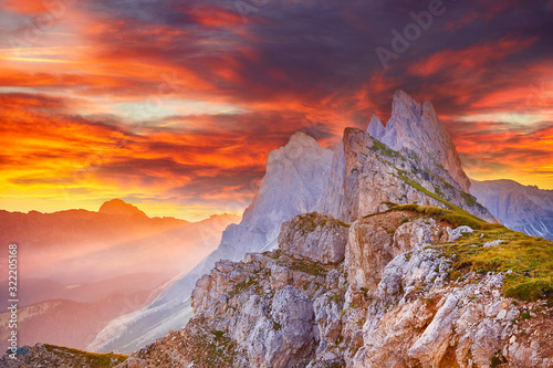 Amazing view on Seceda peak. Trentino Alto Adige, Dolomites Alps, South Tyrol, Italy, Europe. Odle mountain range, Val Gardena. Majestic Furchetta peak in morning sunlight.. © zicksvift