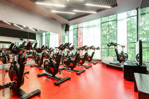 Stationary Spinning bicycles. Indoor cycling for lifestyle design. Fitness background. Healthy lifestyle background. Spinning class with empty bikes. Sport background. Sport, recreation, lifestyle