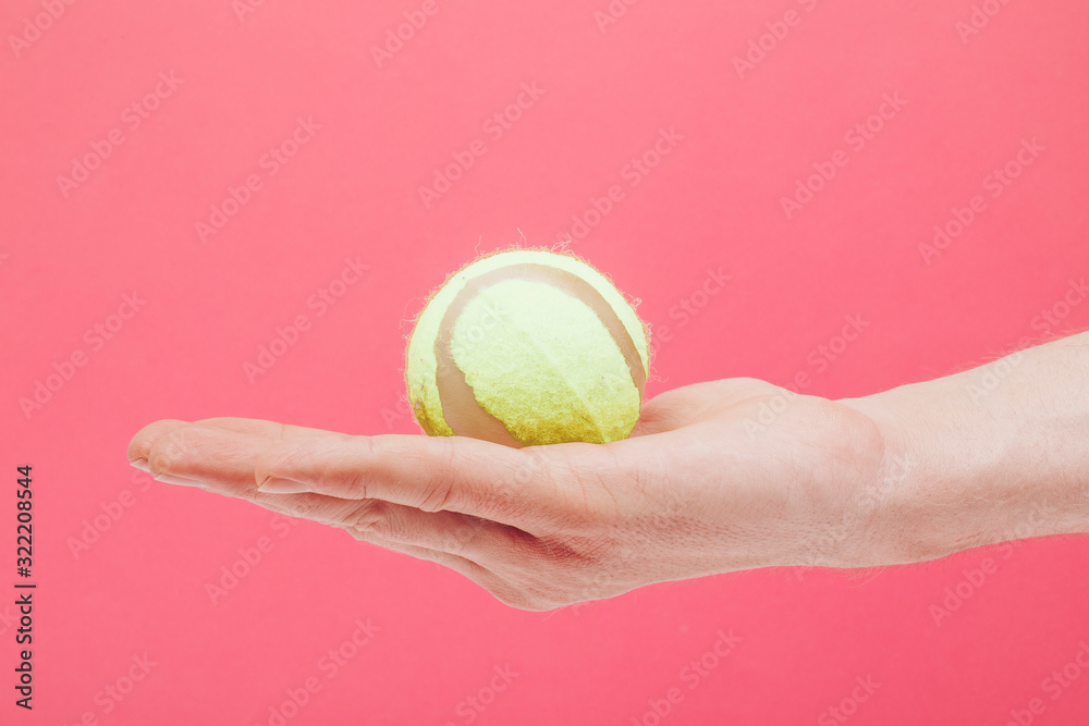 Man hand tennis ball. 