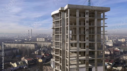 Aerial view of concrete frame of tall apartment building under construction in a city