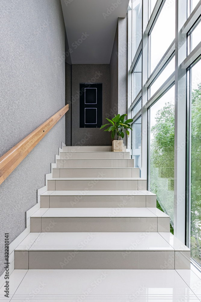 Obraz premium Green staircase window in modern style on white background. Interior design wall. Modern interior design. Modern stylish apartment. Concrete wall. Bright interior.
