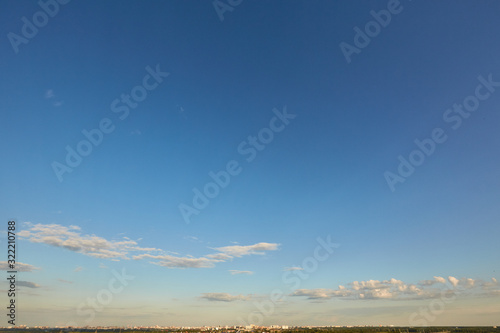 Blue aerial landscape on light background. Empty background scene. Panoramic view. Sky blue background. Urban scene. Sunny day, blue sky. Wide angle. Wide panorama. Aerial view. Sky clouds.