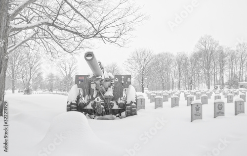 M1A2 Howitzer, Canadian National Military Cemetery, gravestones in snow, nobody
