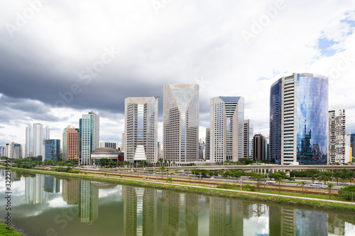 Pinheiros river in Sao Paulo  Brazil  with modern buildings and their reflections in the water