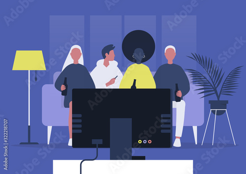A diverse group of young adult friends watching TV and drinking beer, home party