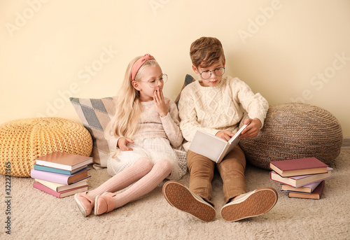 Little children reading boo...