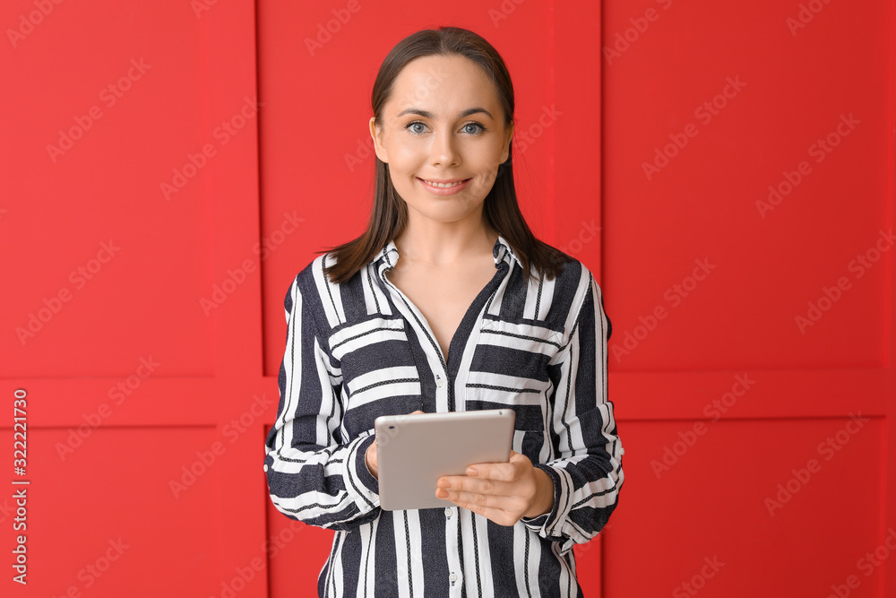 Young woman with tablet computer on color background Young woman with tablet computer on color background