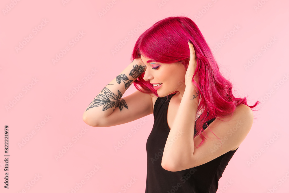 Naklejka premium Beautiful young woman with unusual hair on color background