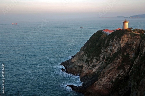 Lighthouse on a cliff at Cape D'aguilar, or Hok Tsui, on the southeastern tip of Hong Kong Island © Queenie
