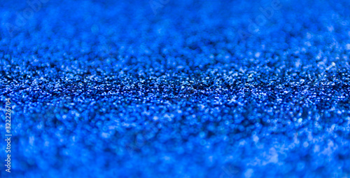 Blur blue sparkle background. Defocused glitter texture