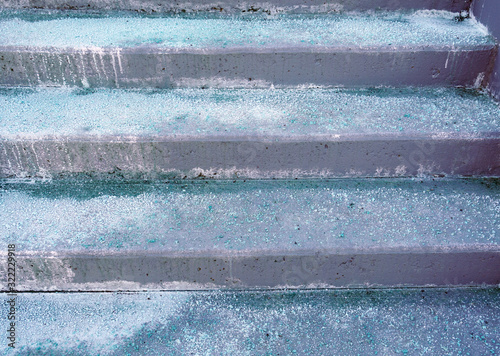 Melting salt on the stair steps in winter season