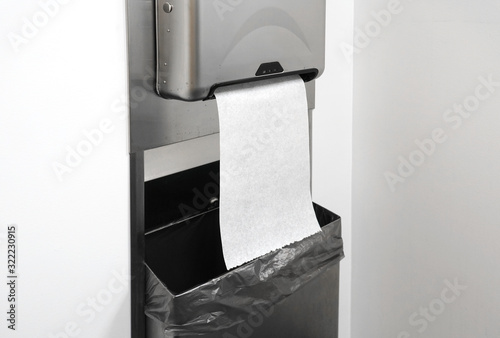 Fotografie close up on paper towel dispenser on the wall