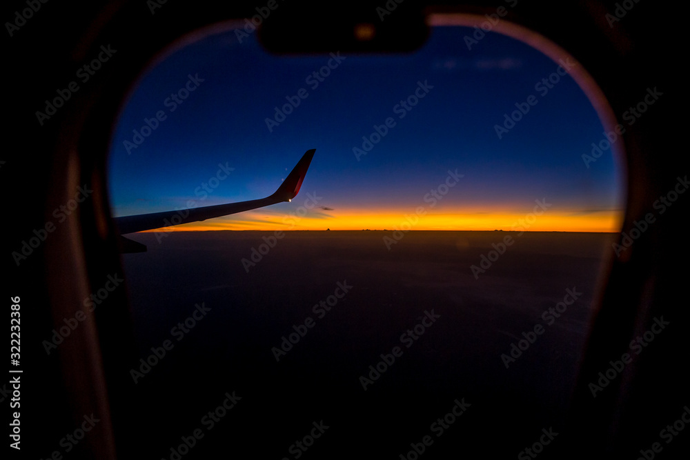 Blurred abstract background of high angle views from the plane window, can see the natural atmosphere during the air travel (mountains, rivers, morning light) Blurred abstract background of high angle views from the plane window, can see the natural atmosphere during the air travel (mountains, rivers, morning light)