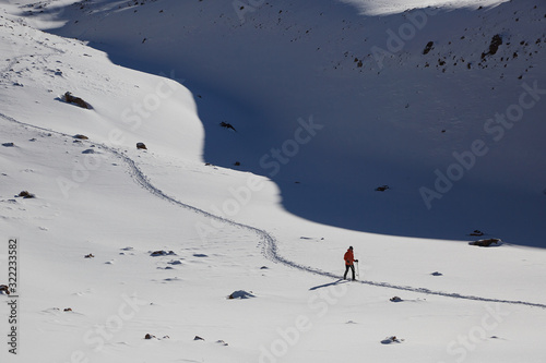 tourist walking on a trail in the snow