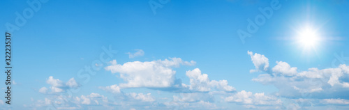 Beautiful blue sky with white clouds and sun  panorama