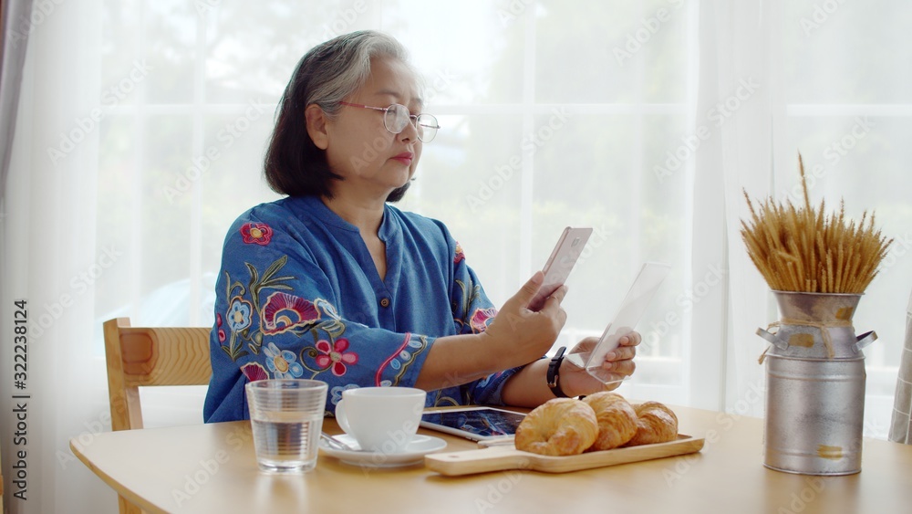 Senior woman use smartphone payment with QR Code Senior woman use smartphone payment with QR Code