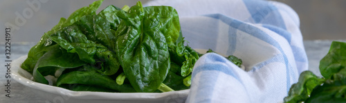 Close up view of raw spinach salad, vegetarian healthy ingredient