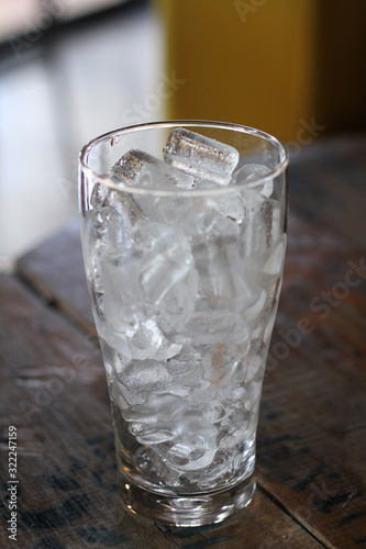 ice in a glass isolated on black background 