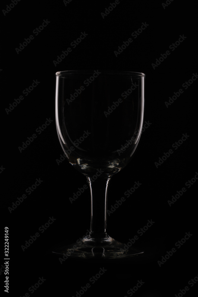 wine glass as idea and concept lighting and black background.