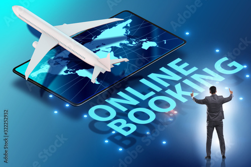 Concept of online airtravel booking with businessman photo