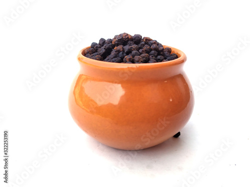 Black pepper peas put in a blue bowl isolated on white background