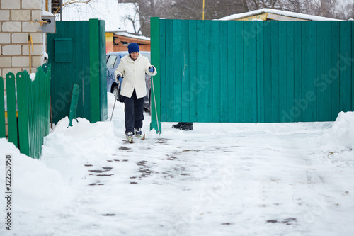 man skier riding by snowy piste. dilettante, dabbler, layman.