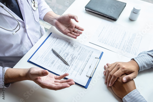 Doctor consulting with patient and checking sickness condition while presenting results diagnosis symptom examining about the problem of illness and recommend treatment method, Healthcare and medical