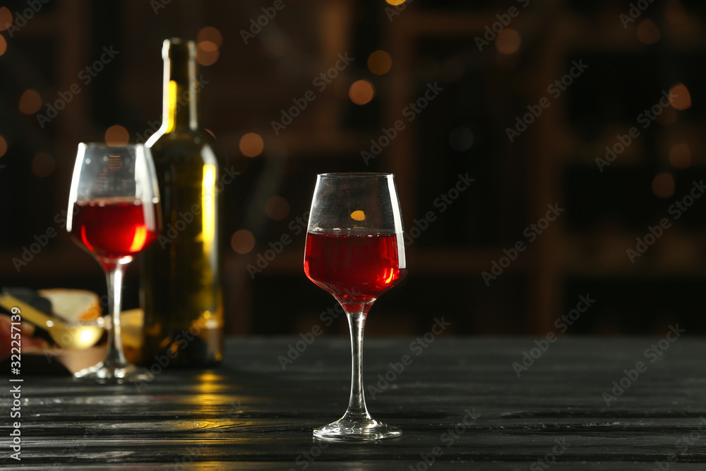 Glass of delicious wine on table in bar Glass of delicious wine on table in bar