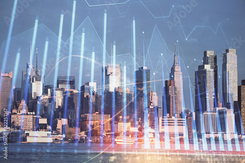 Forex graph on city view with skyscrapers background double exposure. Financial analysis concept.