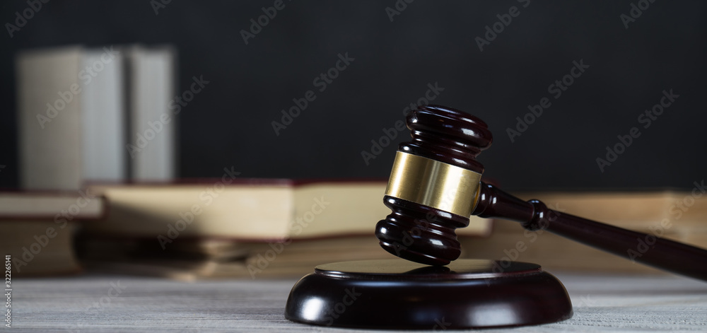 Law and Justice symbols over black background Law and Justice symbols over black background