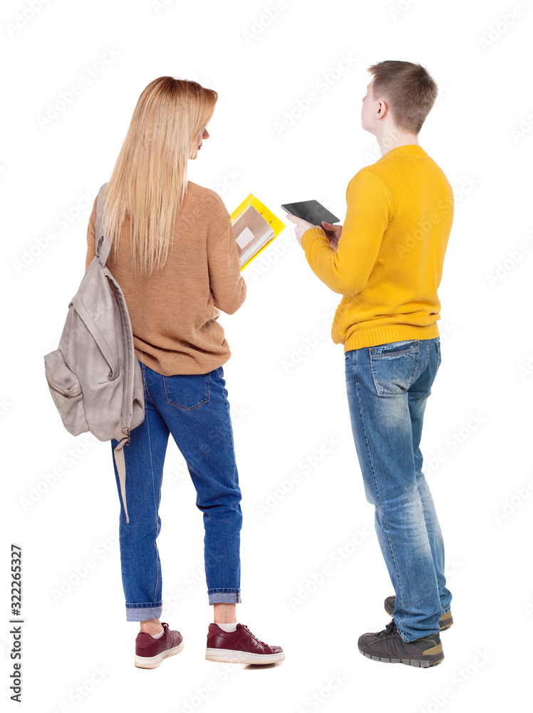 Back view of couple in sweater with mobile phone. Back view of couple in sweater with mobile phone.