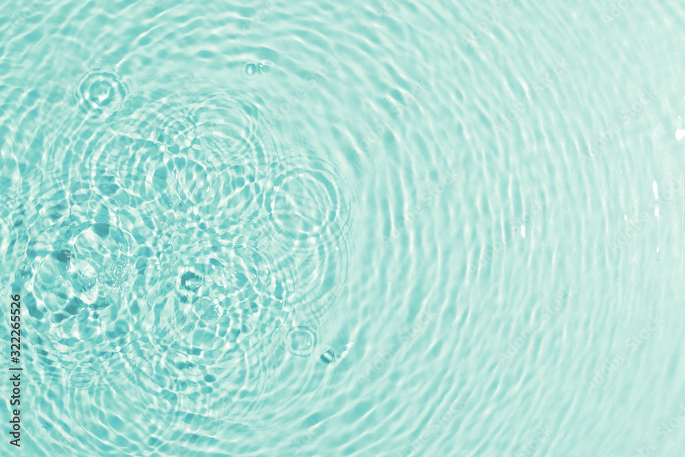 texture of splashing clean water on turquoise background texture of splashing clean water on turquoise background
