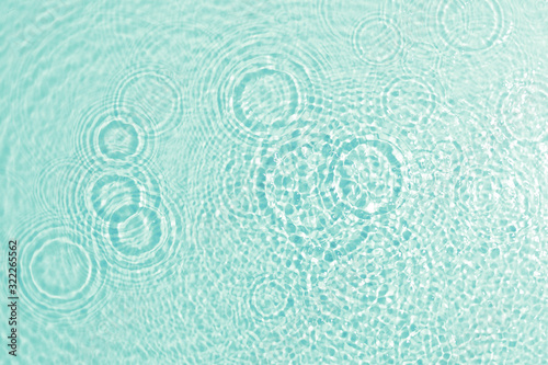 texture of splashing clean water on turquoise background